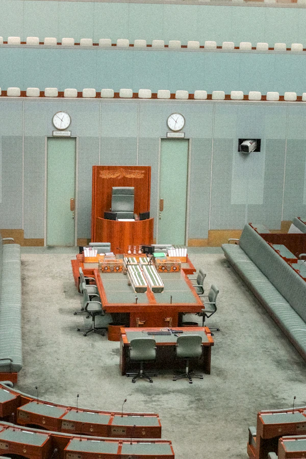Public assembly chamber with desks, seating and microphones