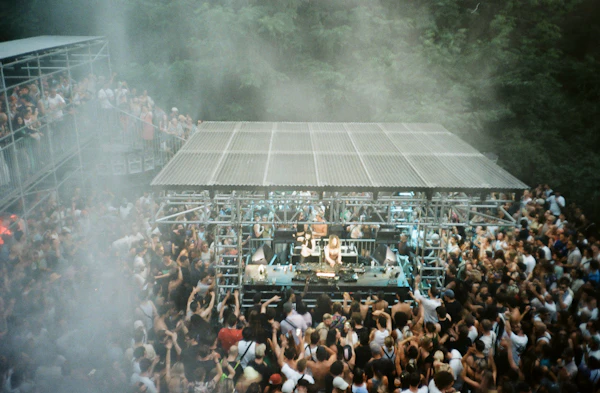 Outdoor music festival with a stage and audience