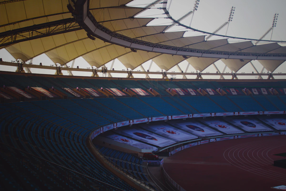 Sports stadium with tiered seating and an athletics track